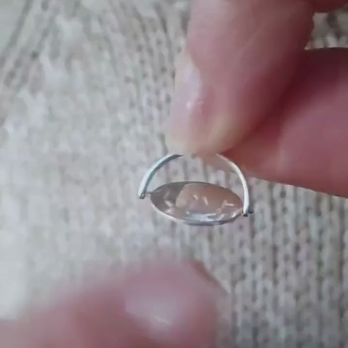video of i love you pendant  which says I love only when spinned 