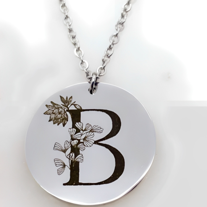 92.5  Sterling silver Pendant  which is engraved with Initial &  Birthflower engraved on it by CHOKHA INDIA 