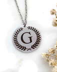 pendant made with 92.5 sterling silver with letter g engraved in it