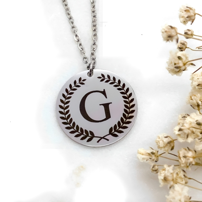 pendant made with 92.5 sterling silver with letter g engraved in it