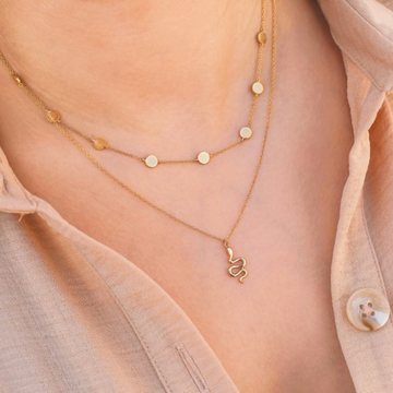 Model Wearing gold plated dainty snake pendant by chokha india