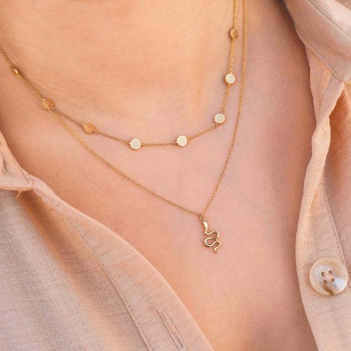 Model Wearing gold plated dainty snake pendant by chokha india