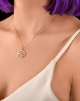 model wearing "Sterling silver Eye of Ra pendant on a delicate chain"