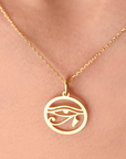 eye of ra pendant on a super model's neck