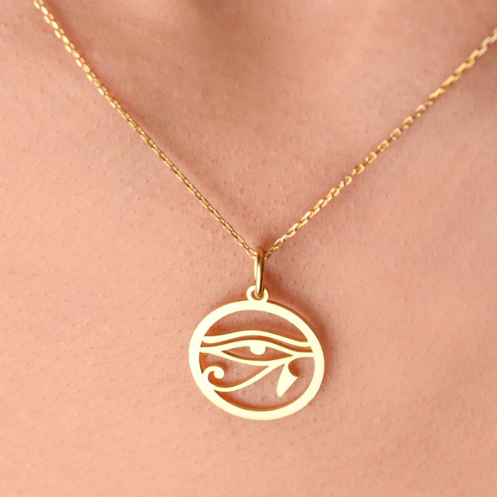 eye of ra pendant on a super model's neck