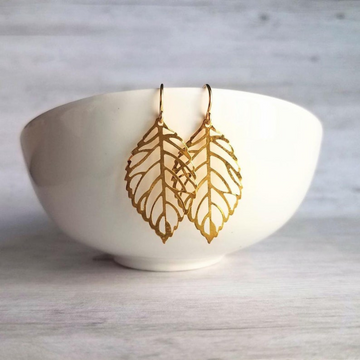 gold plated leaf shaped earrings which are made of 92.5 sterling silver by chokha india
