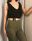 model wearing black top and olive pants with golden waist band by chokha india