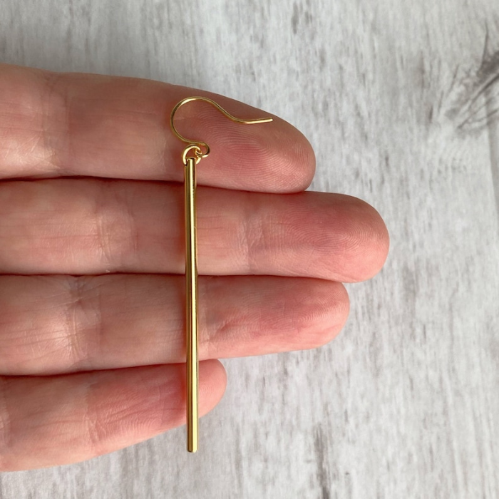 shimmer earrings in hand 
