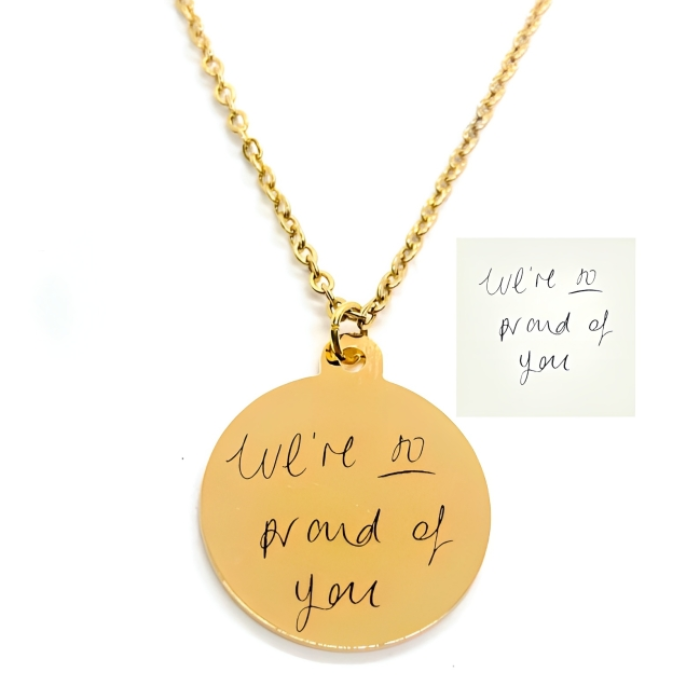 A circle shaped gold plated pendant on which you can get a personalized pendant 