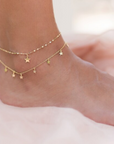 model wearing dainty star charm anklet with dainty star ankle bracelet by chokha india