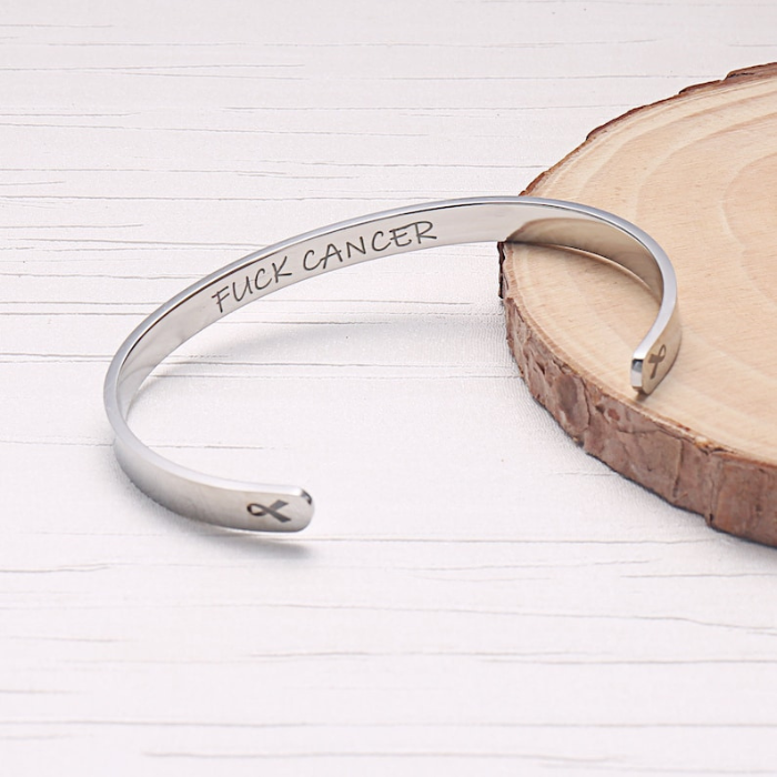 sterling silver bracelet cuff designed specially for cancer patients and survivors which says fuck cancer on the inside