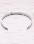 sterling silver bracelet cuff designed specially for cancer patients and survivors which says fuck cancer on the inside