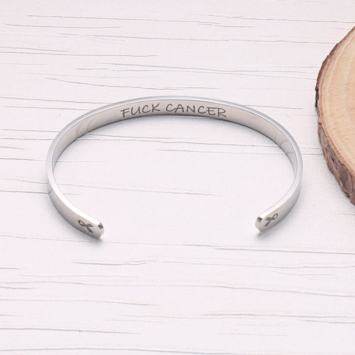 sterling silver bracelet cuff designed specially for cancer patients and survivors which says fuck cancer on the inside