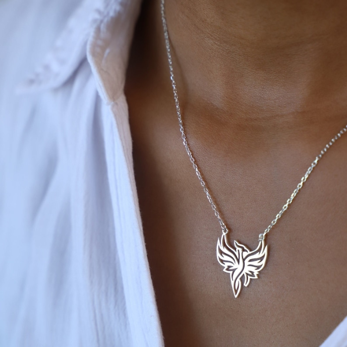 model wearing white shirt with sterling silver phoenix pendant by chokha india and looking like a supermodel 